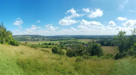 A panorama of Polhill Bank on a sunny day with blue skies.