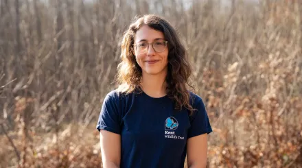 Heidi Aguirregoicoa, stood in front of the woods. Bison and conservation grazing ranger